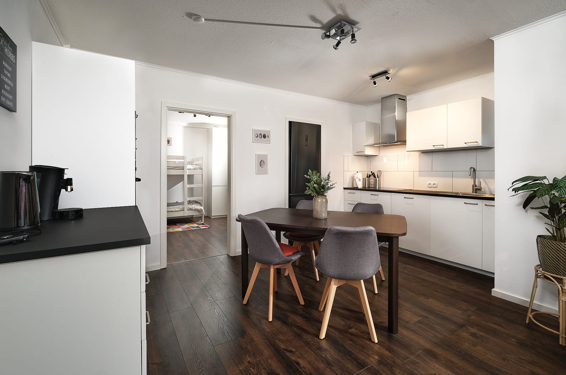 Dining area and open kitchen in Mumo's Inn TLA apartment in Landstuhl near Ramstein Air Base